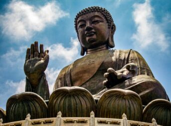 a large statue of a person holding a baby