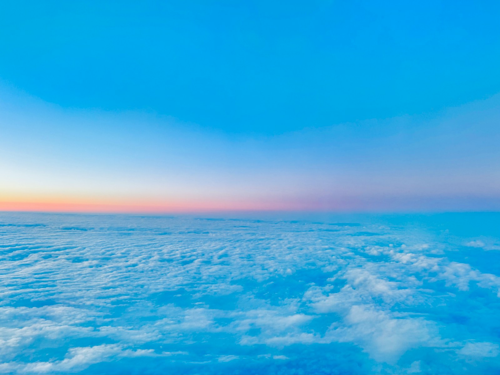 a view of the sky and clouds from an airplane